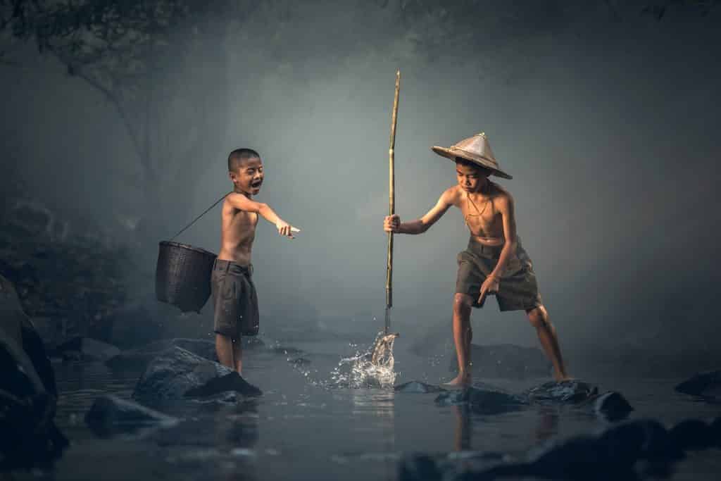 An image of two boys fishing