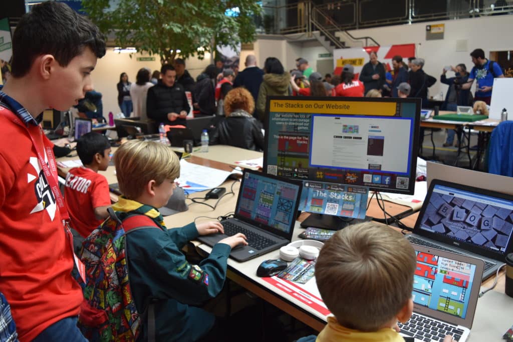 A photo of our stand at Coolest Projects UK, showing The Stacks